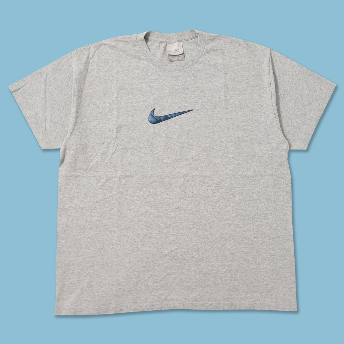 nike tee with swoosh in the middle