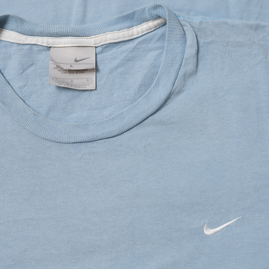 Nike mini swoosh shirt 2025