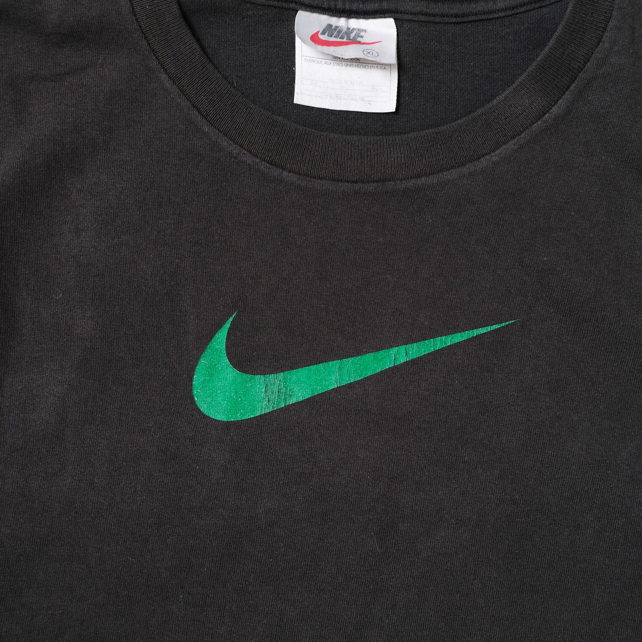 black nike shirt with green swoosh